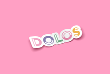 Load image into Gallery viewer, View from an angle - A white outlined sticker that has Dolos written in a colorful font.
